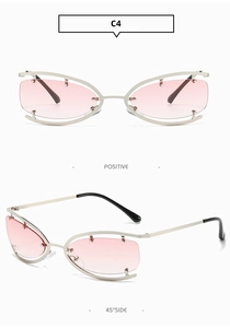 Detail of silver rimless Y2K sunglasses with pink gradient lenses and cut-out frame