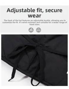 Detailed macro view showing the adjustable drawstring tie on a black winter windproof trapper hat