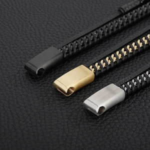 Detail of punk style braided leather bracelet with stainless steel magnetic clasps