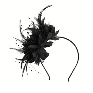 Close-up of black mesh veil and intricate feather details on the bridal fascinator hat