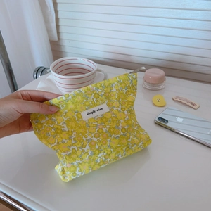 Pochette per cosmetici in cotone a fiori con etichetta semplice e cerniera argento