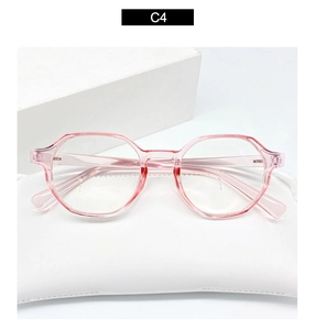 Macro detail of pink translucent geometric eyewear frame on a white leather case
