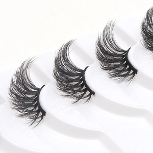 10 pairs of natural thick cat eye false eyelashes made of synthetic fiber in a white tray
