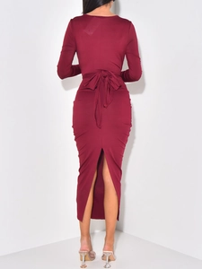 Elegant burgundy long-sleeve evening dress with back waist bow and slit detail