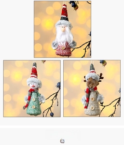 Three-piece set of knitted Christmas dolls featuring Santa, snowman, and reindeer figures