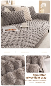 Detail of light gray pineapple grain plush sofa cover showing soft fleece texture and hem