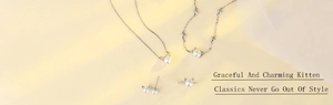 Macro shot of cat ear pearl jewelry set including necklace, bracelet, ring and earrings