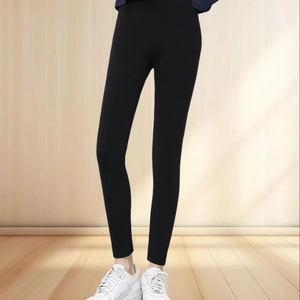 Detail shot of black high-stretch seamless leggings with side diamond accents for women