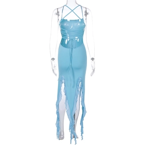 Detail of light blue backless dress featuring criss-cross straps and ruffled high-low hem