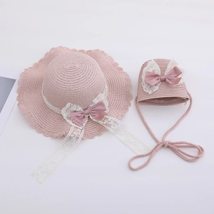 Pink straw hat and matching bag set for kids with white lace and satin bow details