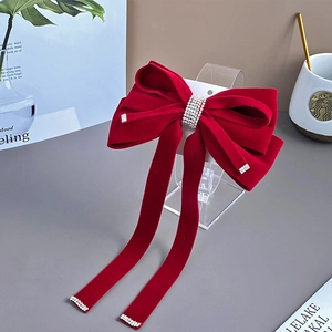 Elegant red velvet bow hair clip with sparkling rhinestone tassels and spring clip style