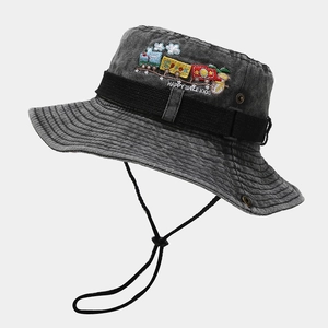 Close-up of grey washed denim bucket hat featuring colorful cartoon train embroidery