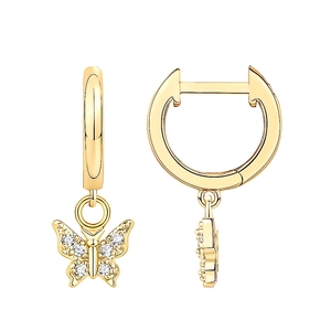 Close-up of golden butterfly earrings with sparkling cubic zirconia in set detail