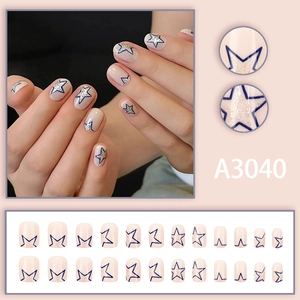 Nude pink square press-on nails with navy blue star patterns and silver glitter accents