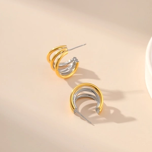 Two-tone gold and silver multi-layer C-shaped stud earrings with 18K gold plating finish