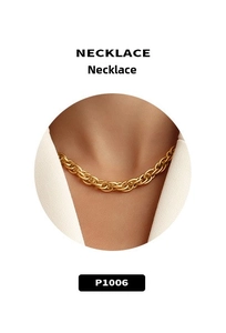 Macro detail of chunky twisted gold-plated necklace with heavy industrial texture