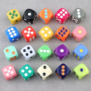 Top view of twenty colorful acrylic six-sided dice for DIY jewelry making and crafts