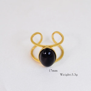 Detail of vintage 14k gold plated ring with large black oval gemstone and 17mm size label