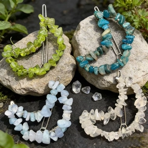Set of four moon-shaped hair clips featuring colorful natural crystal stones on metal