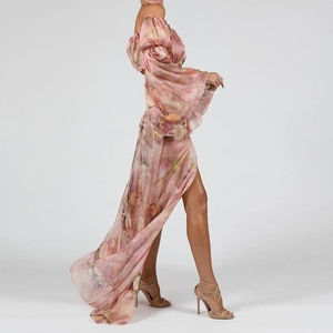 Pink floral print maxi dress with long flare sleeves and side split in a flowy design