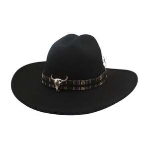 Close-up of a high-end black cowboy hat with an ethnic pattern band and bull skull.