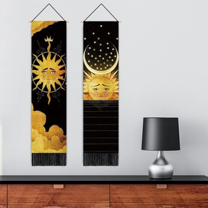 Nordic wall hanging set with celestial sun and moon designs in black and gold with tassels