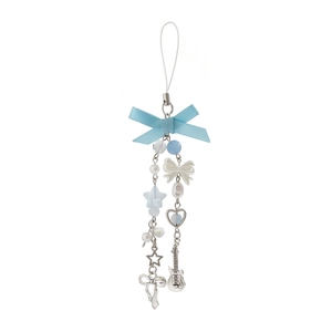 Close-up of light blue ribbon bow with star beads and silver guitar charm on keychain