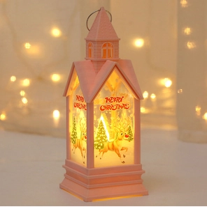 Pink LED Christmas lantern featuring festive reindeer patterns and Merry Christmas text