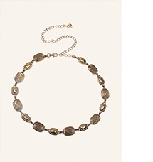 Detail view of retro silver oval links with textured surface and extension chain clasp