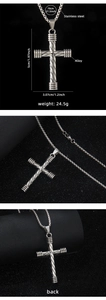 Detail view of silver cross pendant with size metrics and stainless steel chain specs