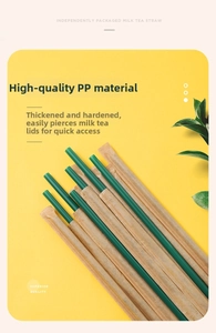 Detail of eco-friendly green PP straws in individual kraft paper packaging for bubble tea