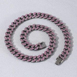 Hip hop iced out Cuban link necklace set in dark metal with pink crystals for street style