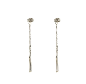 Detailed view of silver tassel earrings featuring sparkling zircon and wave-shaped metal bars
