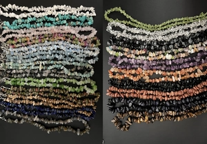 Macro shot of assorted natural crystal stone necklaces with polished irregular beads