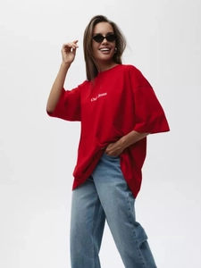 Detail of red oversized cotton T-shirt featuring white Only Jesus text print