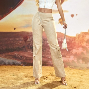 Detail of light beige utility cargo pants featuring large side pockets and paneled stitching