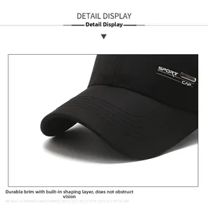Detailed macro view of the black baseball cap showing metal SPORT tag and cotton fabric