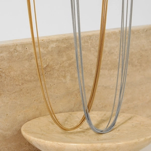 Minimalist multi-layer snake chain necklace in gold and silver stainless steel finish
