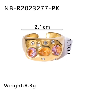 Detail of vintage 18k gold plated ring with pink and orange rhinestones and 1.1cm width