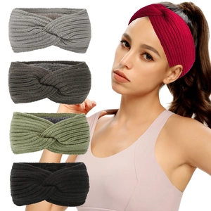 Detail of twisted knit headbands in various colors including red and olive green