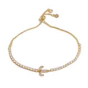 Detail of adjustable gold chain bracelet featuring a CZ diamond letter C pendant