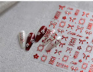 Detailed view of TL-296 red velvet bow and ribbon nail art stickers with metallic finish