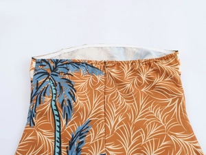 Detail of tropical palm print dress with elastic top and high-quality hidden zipper