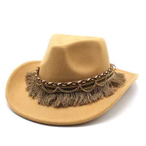 Detail of camel felt fedora with woven tassel band and gold chain accent decoration