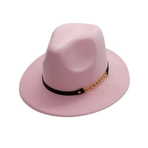 Detailed view of pink fedora hat featuring a black band and gold chain decoration