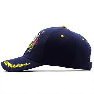 Detailed golden laurel leaf and eagle badge embroidery on a navy cotton baseball cap