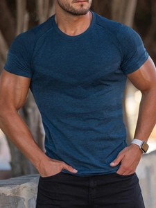Detail of blue athletic t-shirt with geometric mesh texture on the chest area