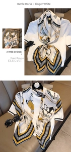 Detail of elegant mustard and white silk scarf with vintage carriage and horse pattern