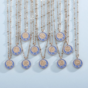 Detailed collection of zodiac necklaces with blue enamel pendants on gold beaded chains