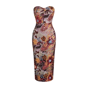 Close-up of vibrant sequined floral embroidery on a slim strapless evening gown